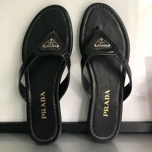 black Prada flip flops